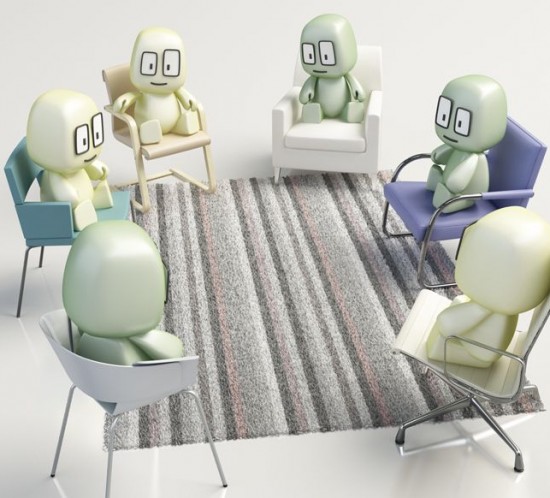 Grupo de Arasis sentados en sillas en círculo sobre una alfombra en un grupo de supervisión